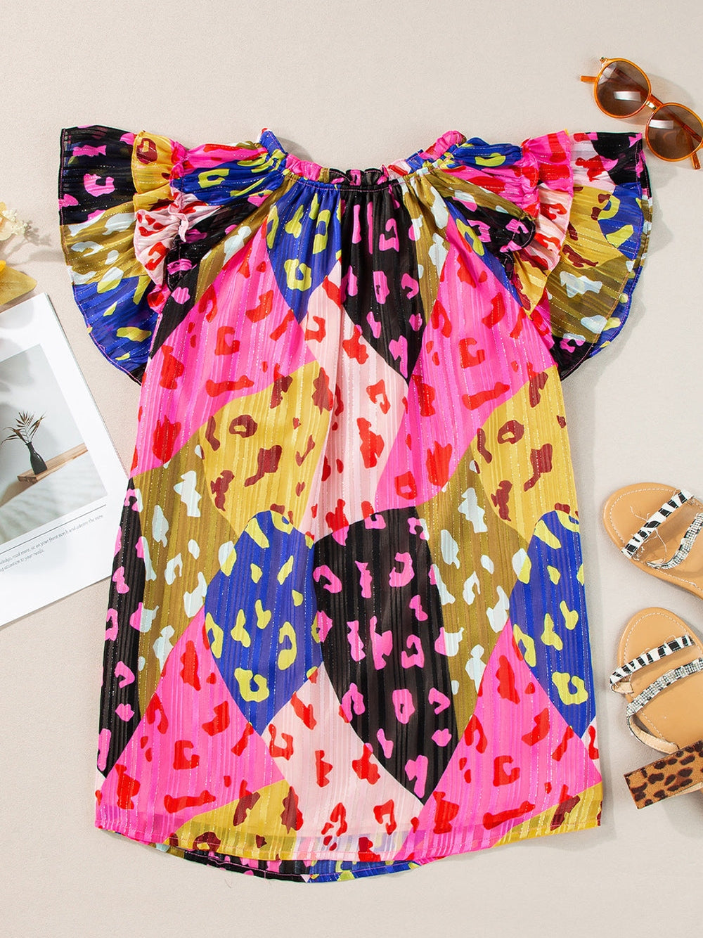 Ruffled Printed Tie Neck Cap Sleeve Blouse