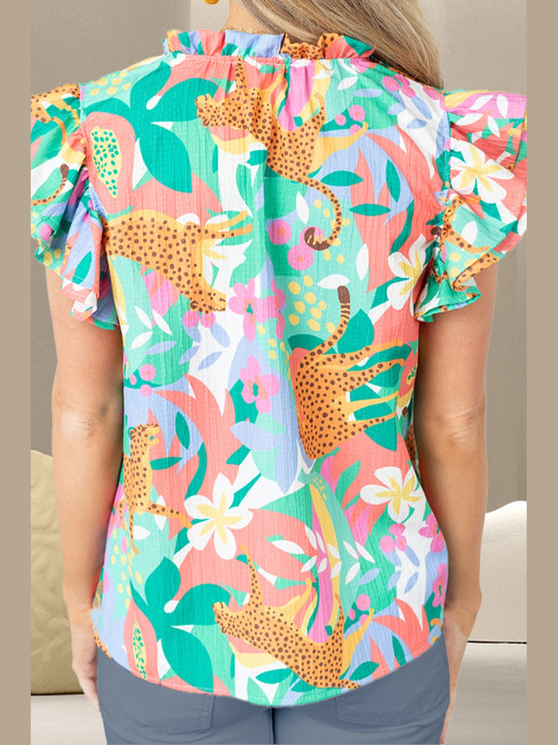 Ruffled Printed Tie Neck Cap Sleeve Blouse
