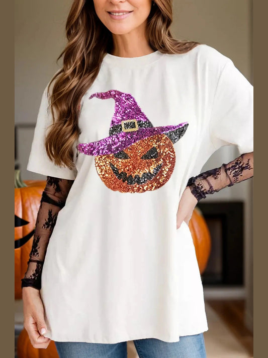 White round neck short sleeve t-shirt with sequin pumpkin wearing a purple witch hat design