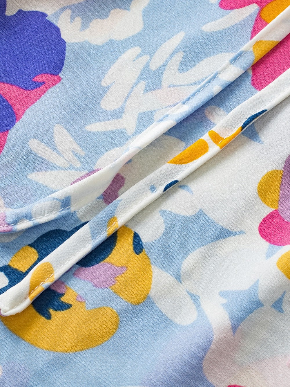 Ruffled Printed Tie Neck Cap Sleeve Blouse NicholesGifts