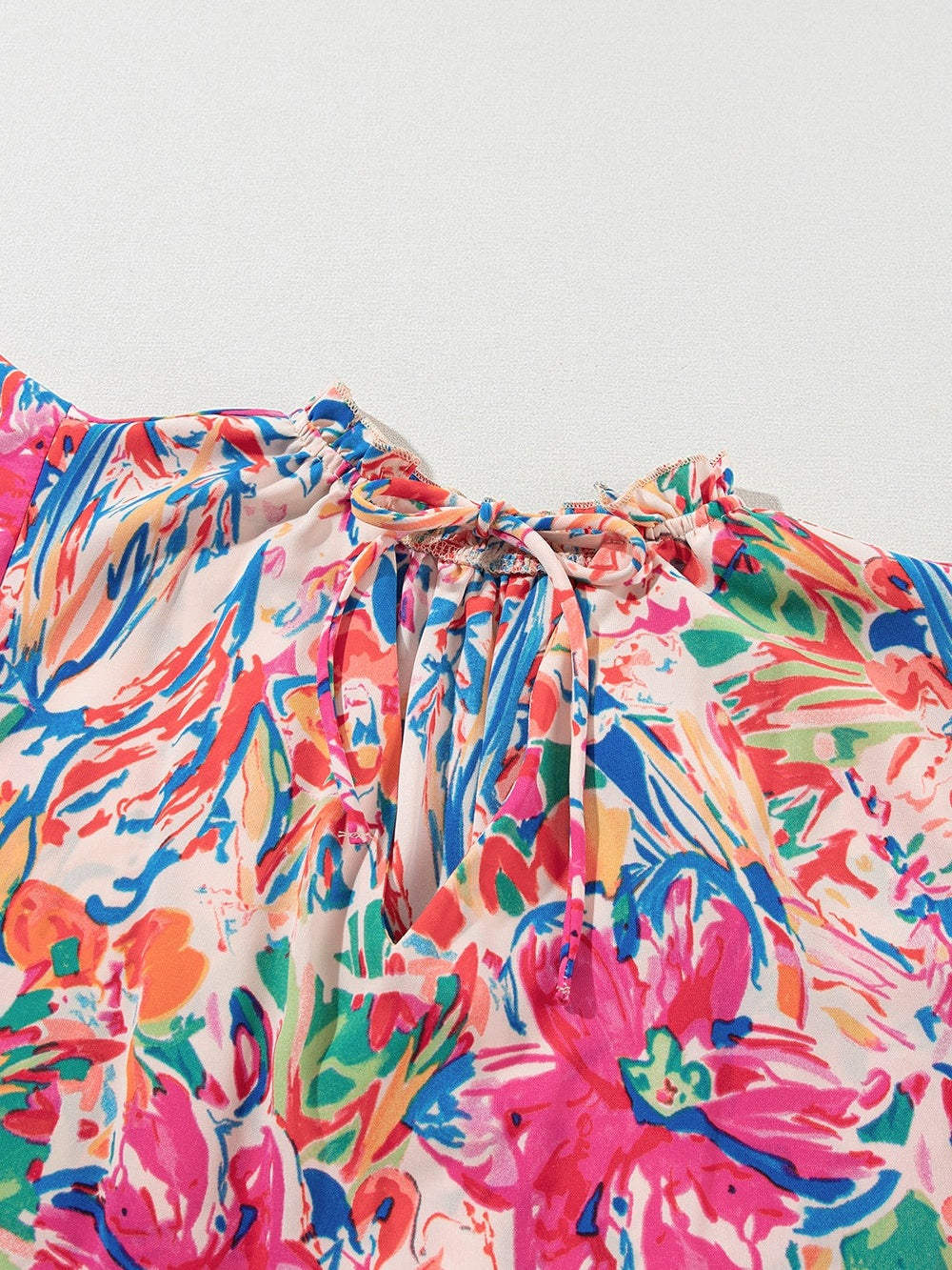 Women Ruffled Printed Tie Neck Cap Sleeve Blouse