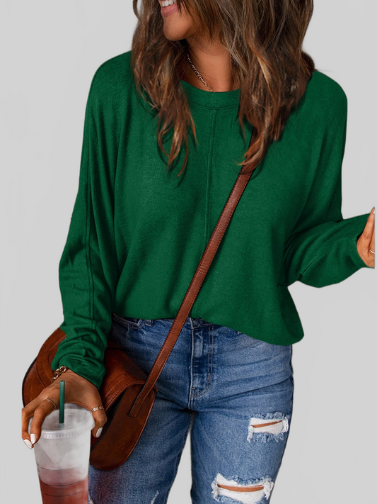 Women Double Take long sleeve t-shirt in solid dark green with a round neck, slightly stretchy polyester blend fabric, and a relaxed fit.