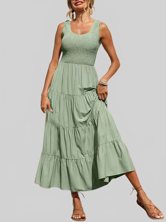 Women Tiered Smocked sleeveless summer dress in sage green polyester with a tiered skirt and smocked fitted bodice