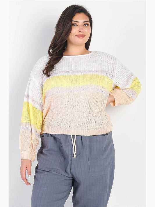 Plus size woman wearing white and lemon striped knit long sleeve top with dropped shoulders and relaxed fit