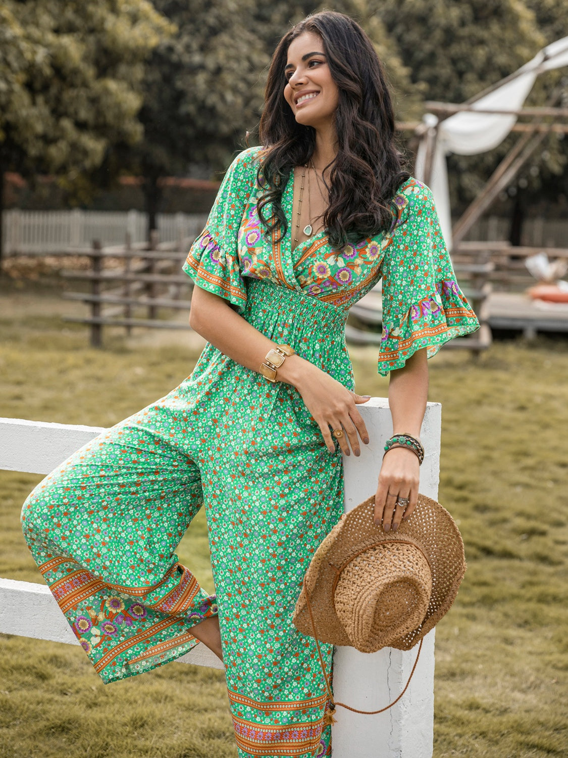 Floral Surplice Flutter Sleeve Jumpsuit nicholesgifts