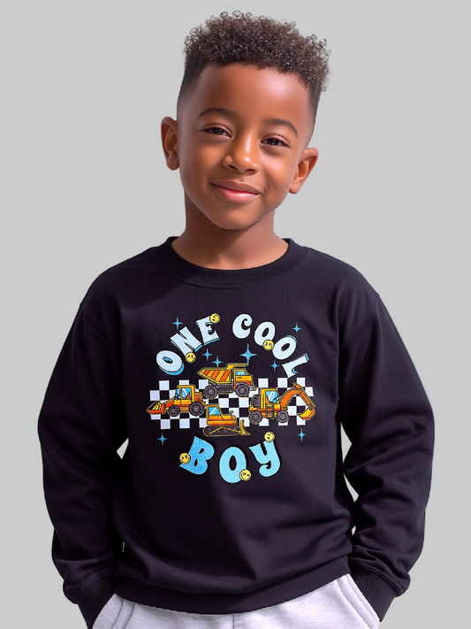 Child wearing a black sweatshirt with 'One Cool Boy' text and graphic on a white background NicholesGifts