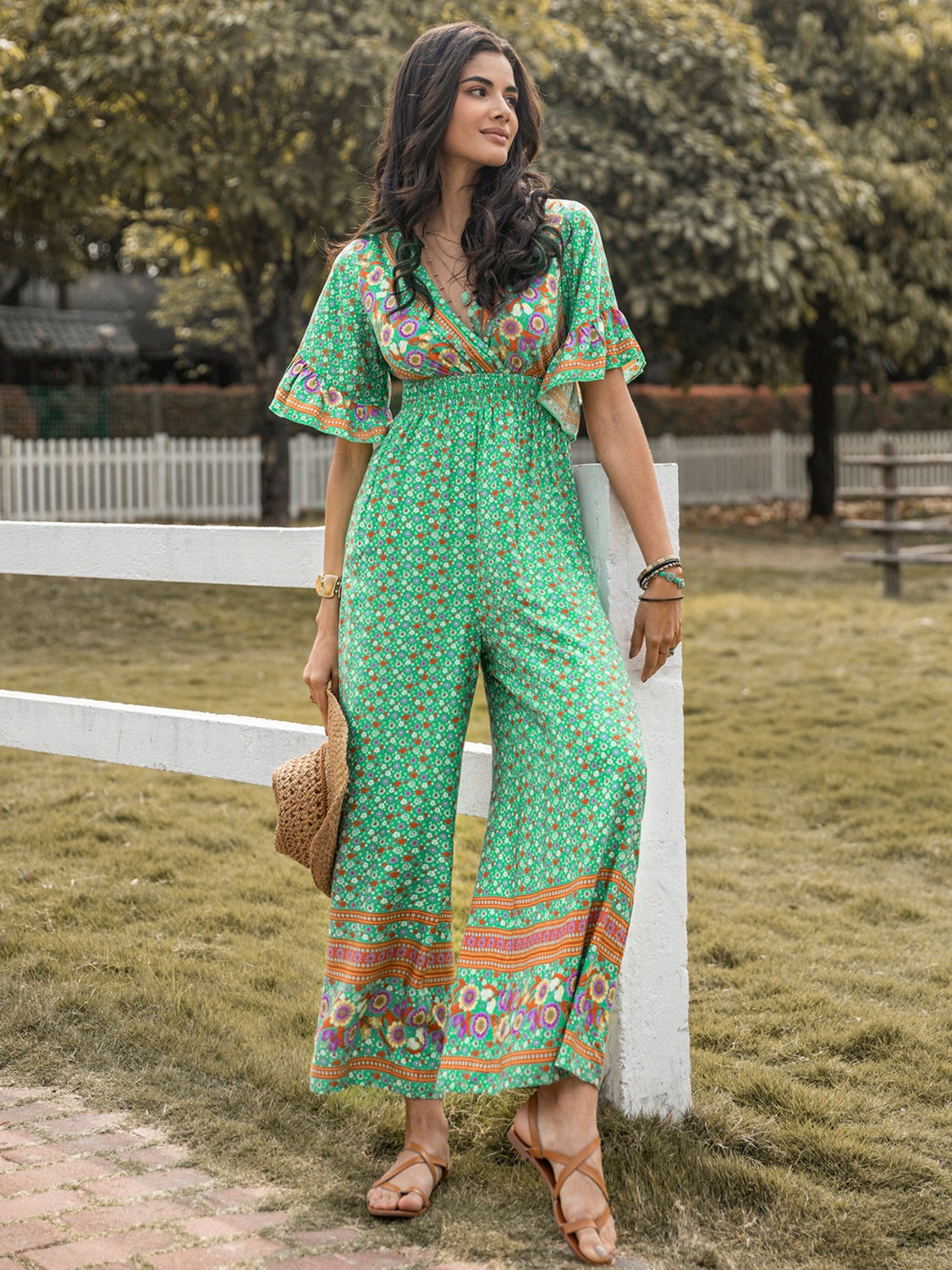 Floral Surplice Flutter Sleeve Jumpsuit nicholesgifts