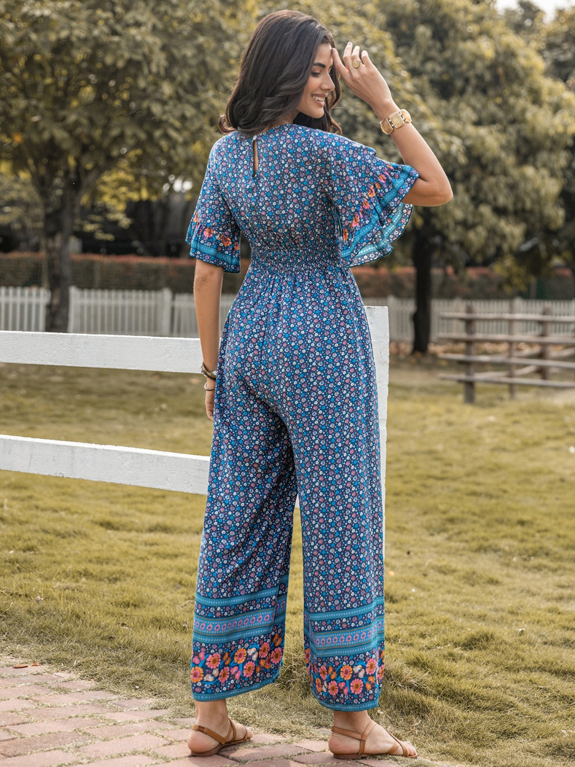 Floral Surplice Flutter Sleeve Jumpsuit nicholesgifts