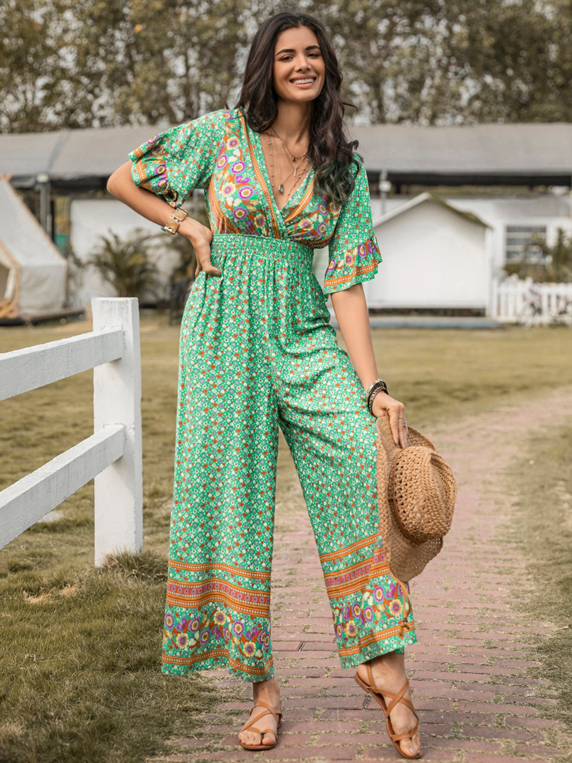 Floral Surplice Flutter Sleeve Jumpsuit nicholesgifts