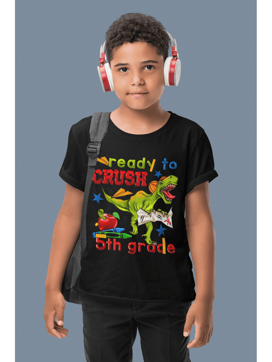 Boys Ready To Crush Fifth Grade Short Sleeve Tee in black cotton featuring colorful dinosaur and school-themed graphic print on front