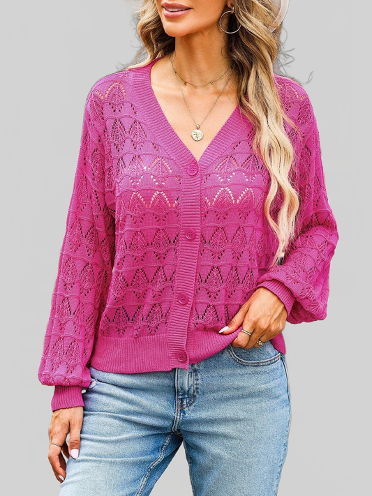 Women openwork V-Neck cardigan in vibrant pink with delicate open-knit pattern, button-up front, and ribbed cuffs and hem.